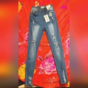 High waisted distressed jeans